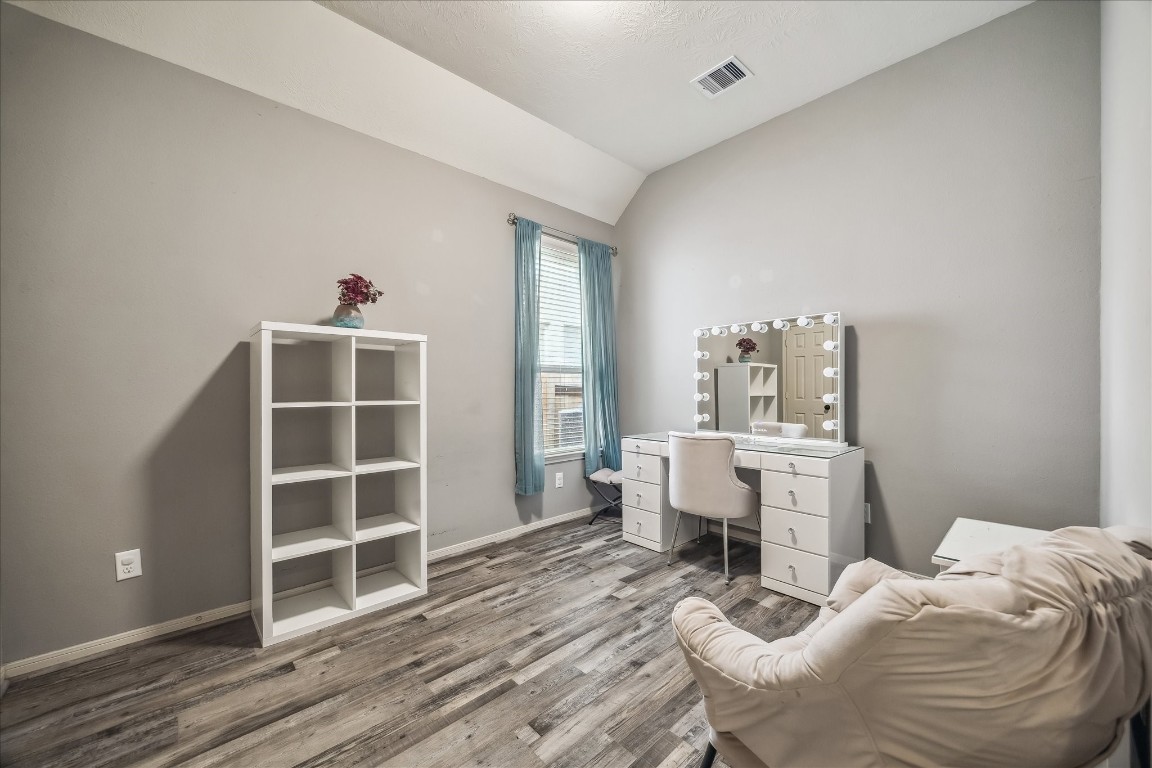 2902 Red Maple Drive Katy, TX 77494 - Photo 25 of 30 a room with furniture a rug and white walls