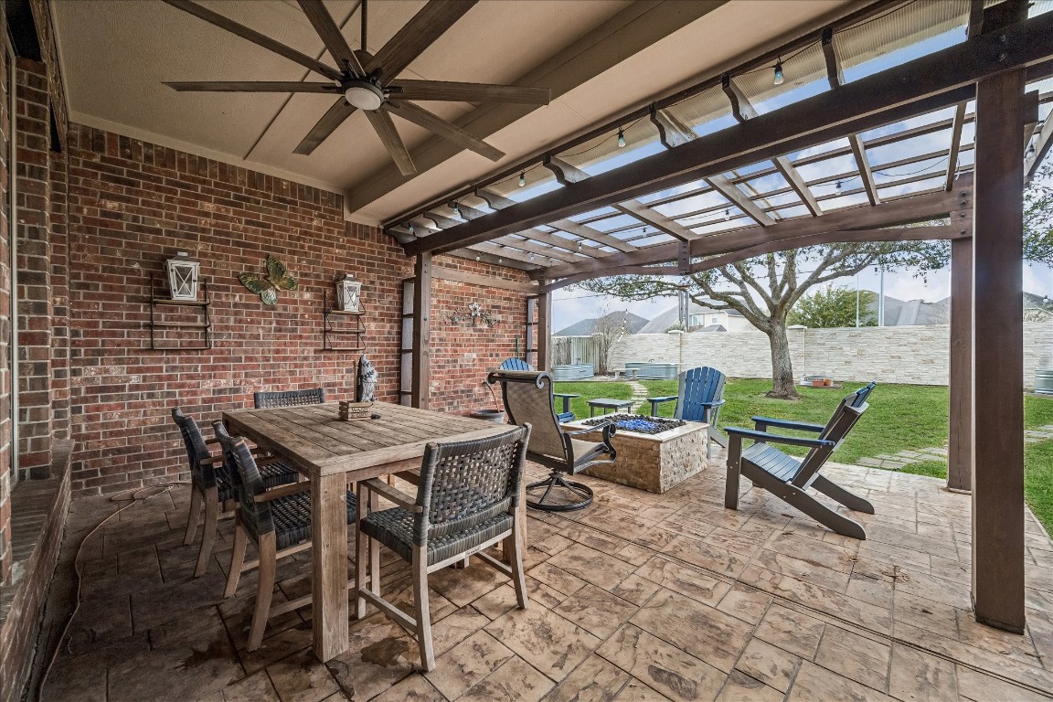 2902 Red Maple Drive Katy, TX 77494 - Photo 29 of 30 a view of a patio with a table and chairs and a barbeque