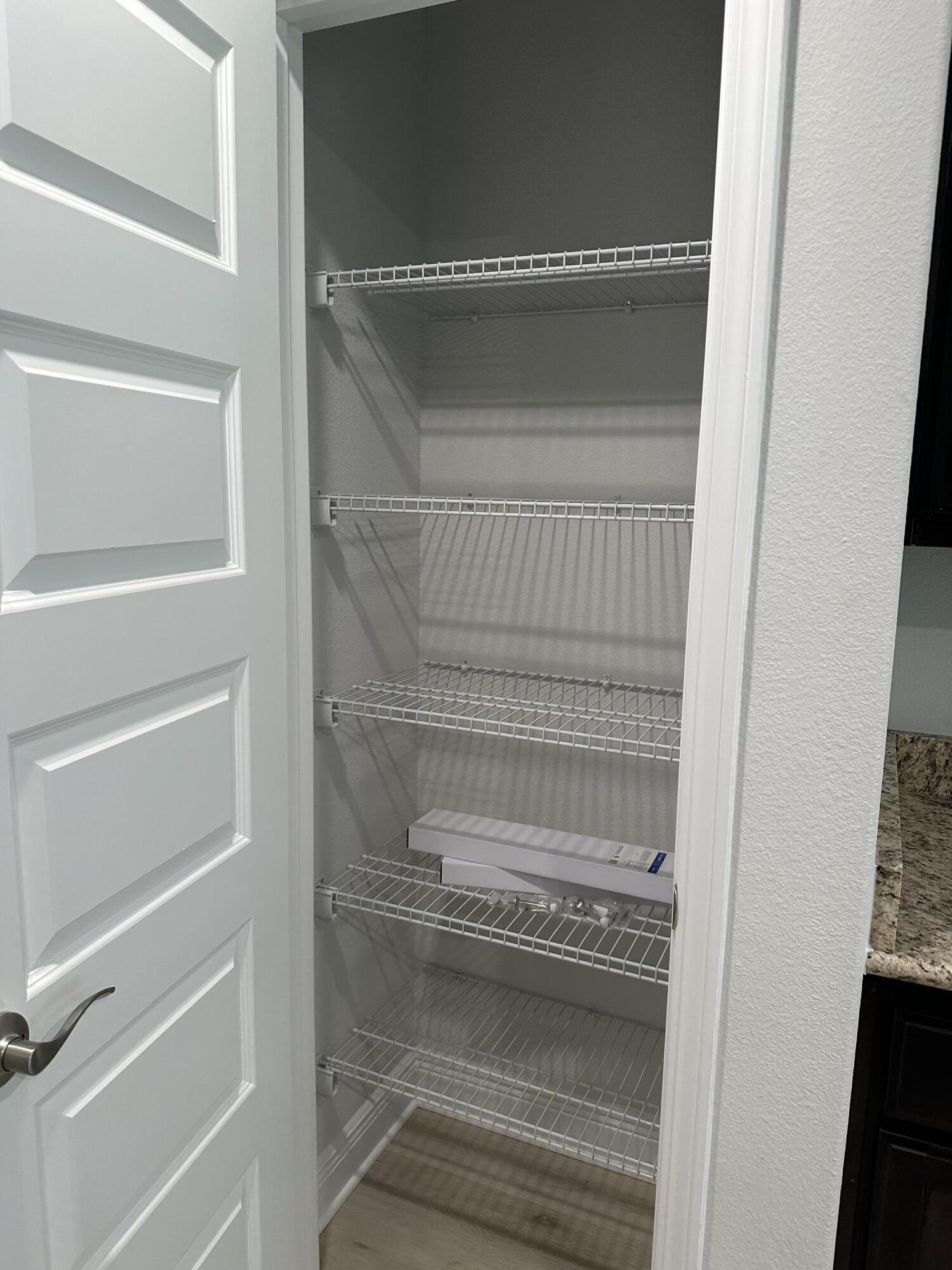 211 Baycliff Drive Crestview, FL 32536 - Photo 15 of 25 a view of walk in closet with empty racks