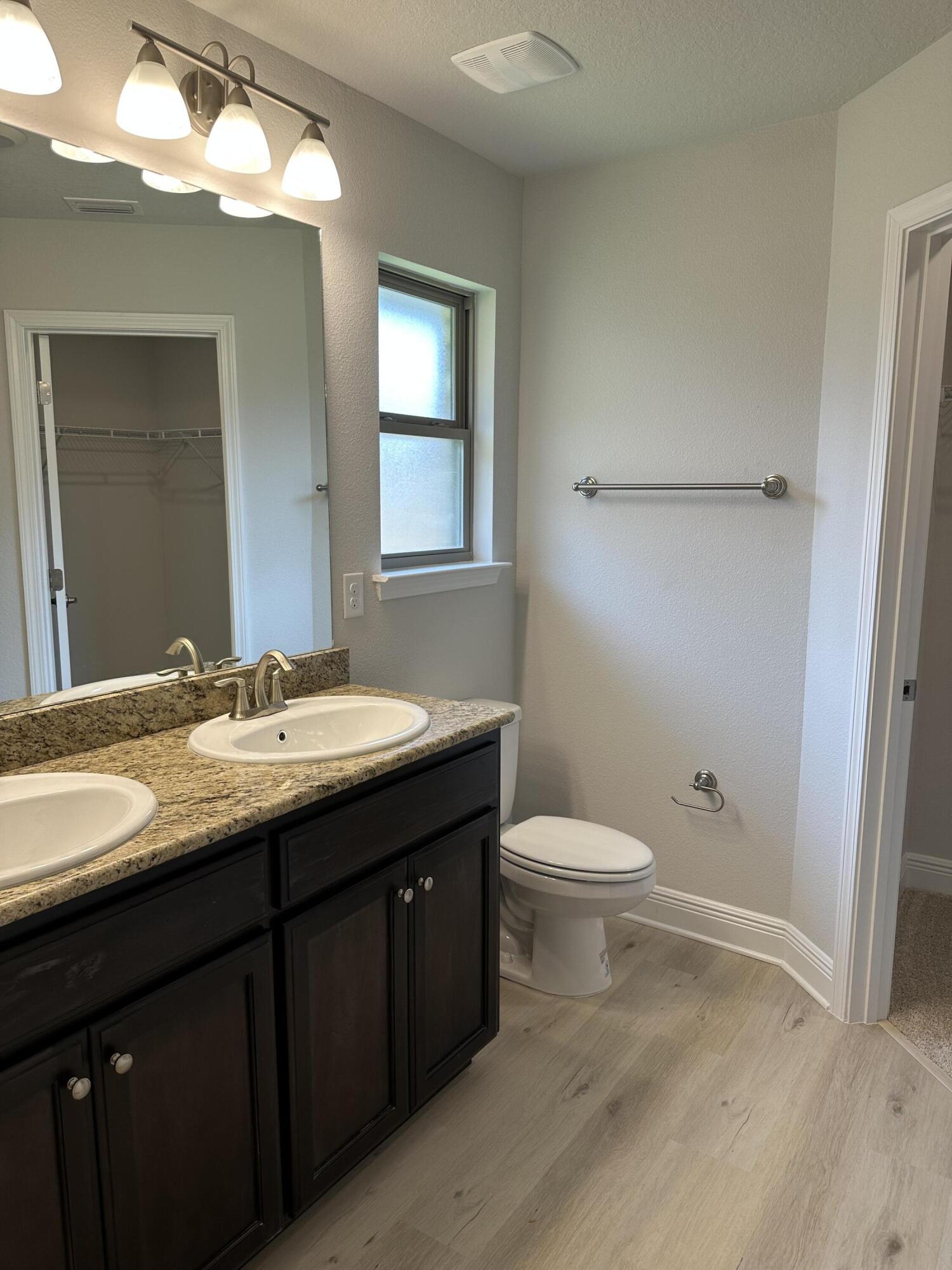 211 Baycliff Drive Crestview, FL 32536 - Photo 20 of 25 a bathroom with a granite countertop sink toilet and shower