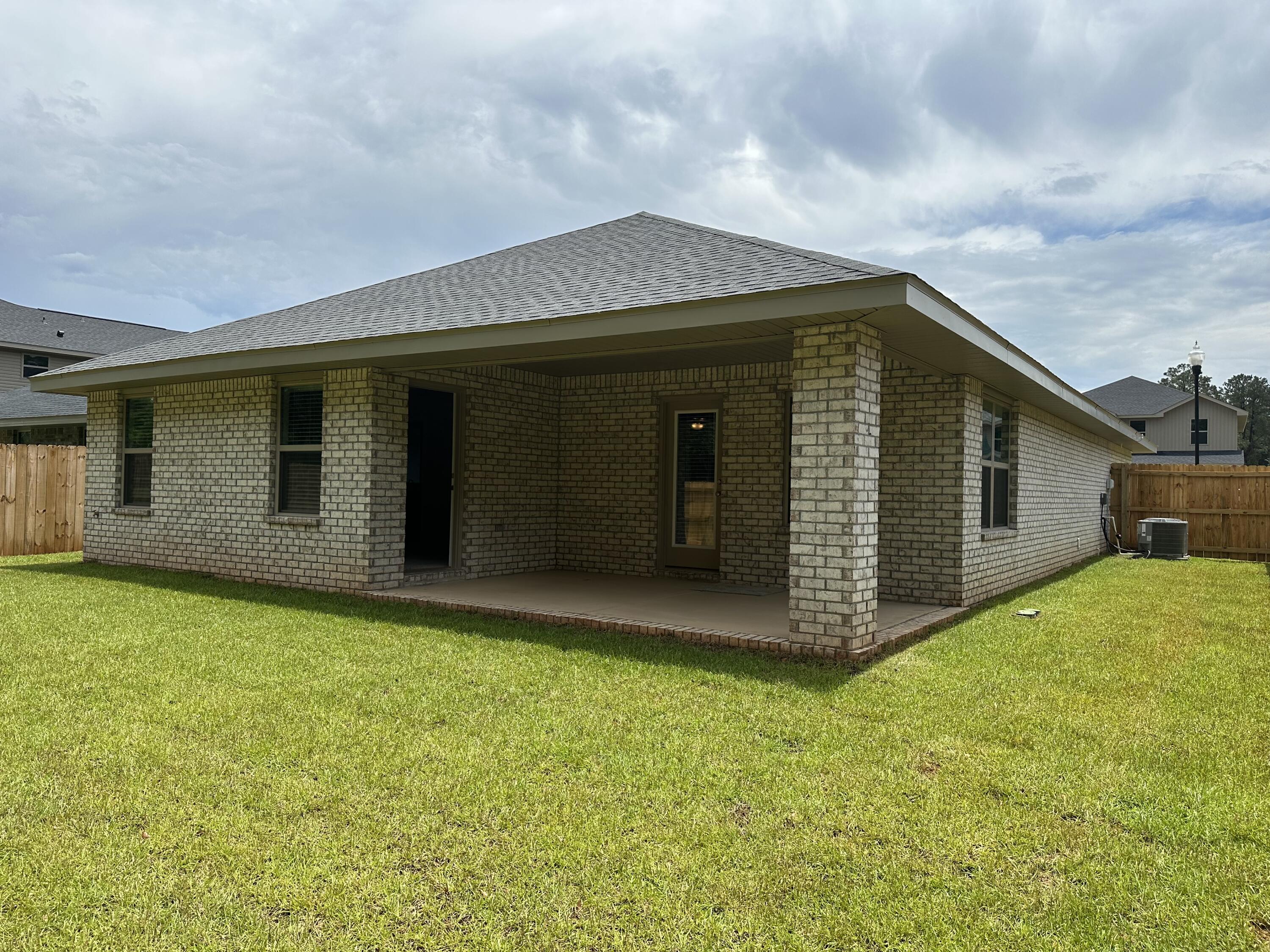 211 Baycliff Drive Crestview, FL 32536 - Photo 23 of 25 a view of a backyard of the house