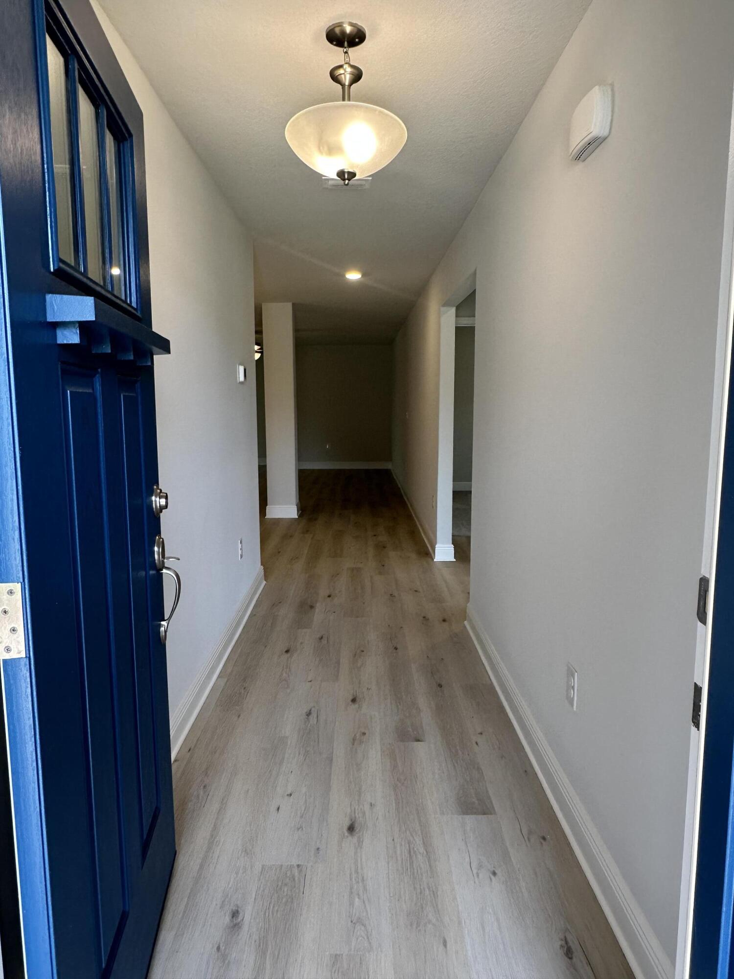 211 Baycliff Drive Crestview, FL 32536 - Photo 4 of 25 a view of a room with wooden floor