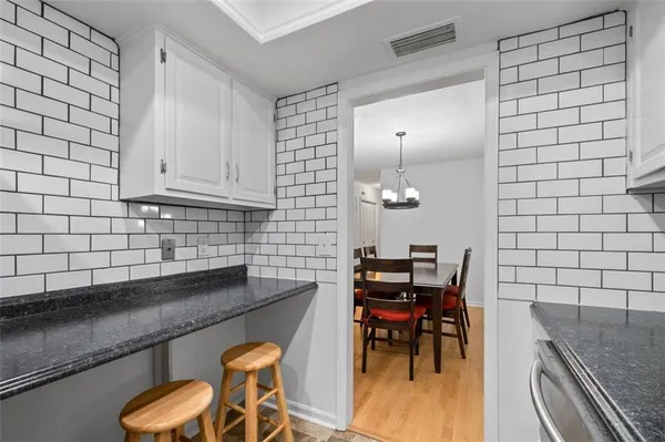 a kitchen with a sink and a stove