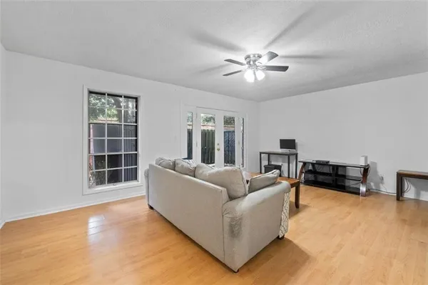 a living room with furniture and a window