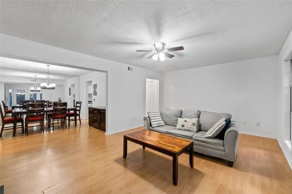 a living room with furniture and a table