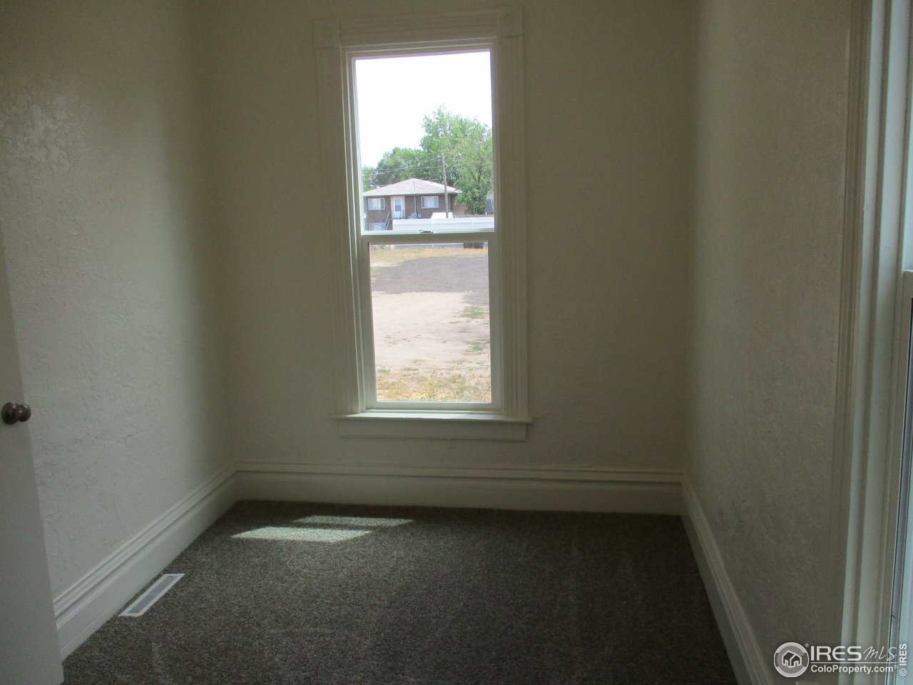 1212 6th Street Greeley, CO 80631 - Photo 6 of 20 a view of a room that has a window in it