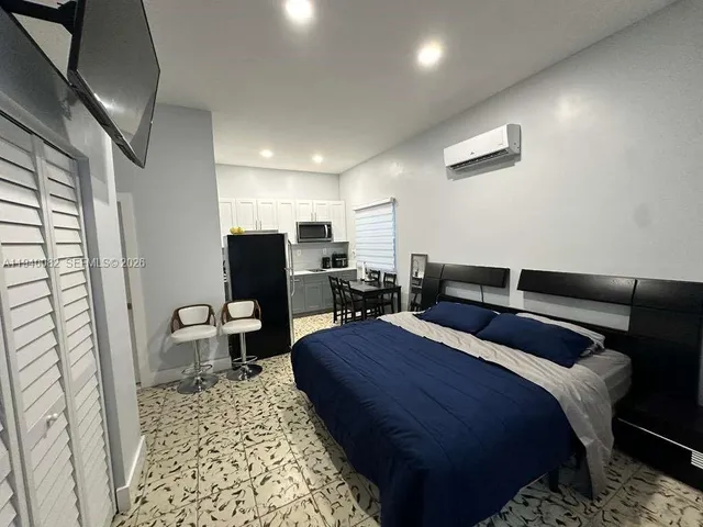 a bed room with two bed and a couch