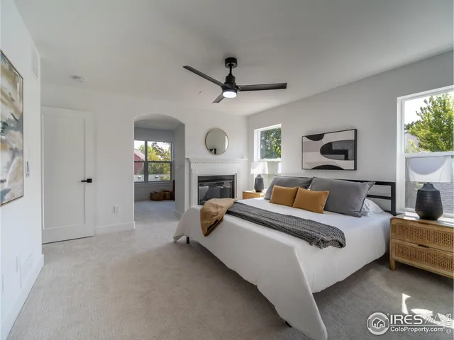 a bed room with furniture and a fireplace