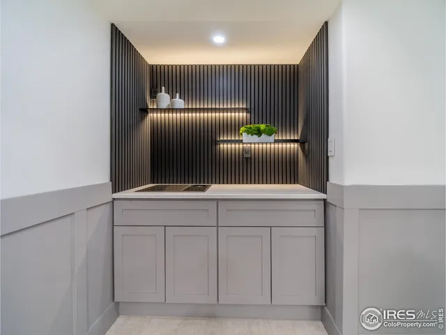 a hallway with a sink and potted plant