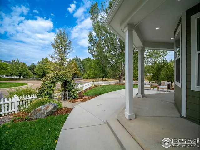 a view of a patio with a garden