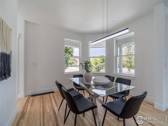 a dining room with furniture and window