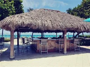 a patio with a table and chairs