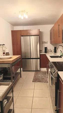 a kitchen with a sink appliances and cabinets