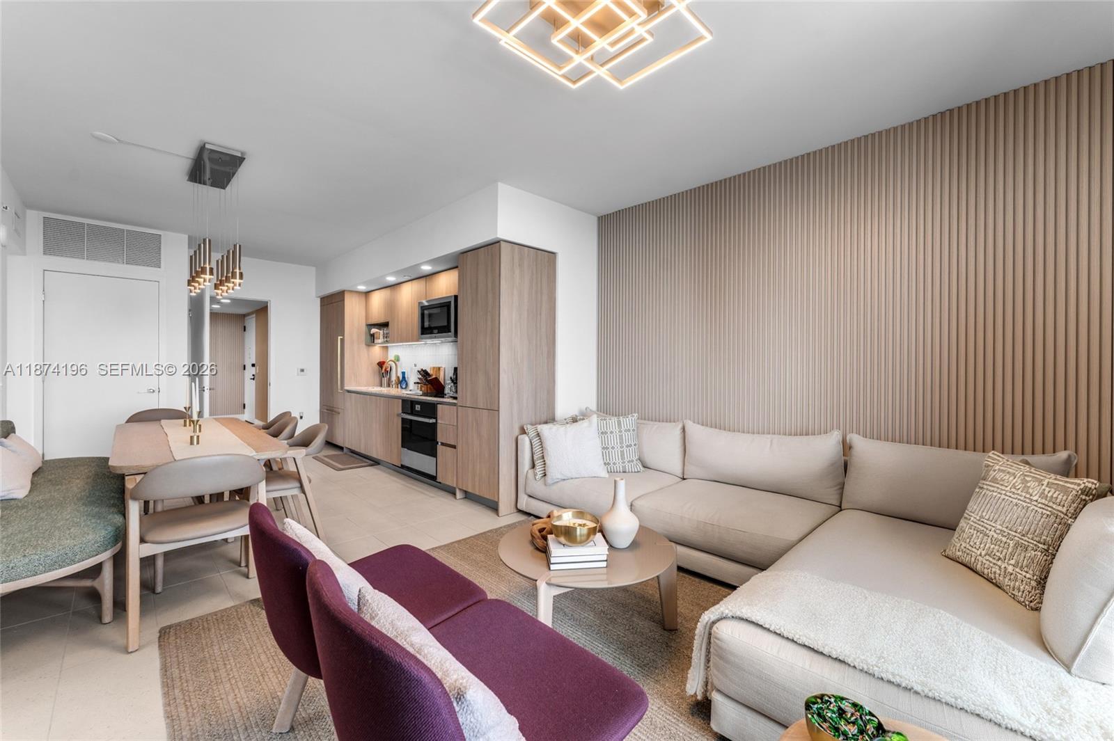 159 Northeast 6th Street, Unit 4016 Miami, FL 33132 - Photo 11 of 50 a living room with furniture and a wooden floor