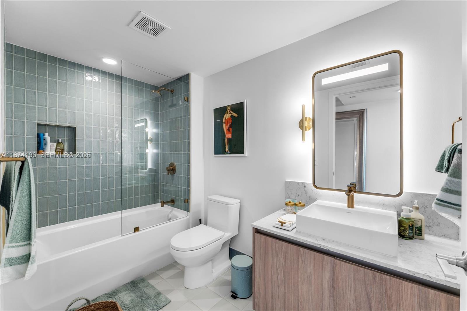 159 Northeast 6th Street, Unit 4016 Miami, FL 33132 - Photo 15 of 50 a bathroom with a sink a toilet and shower