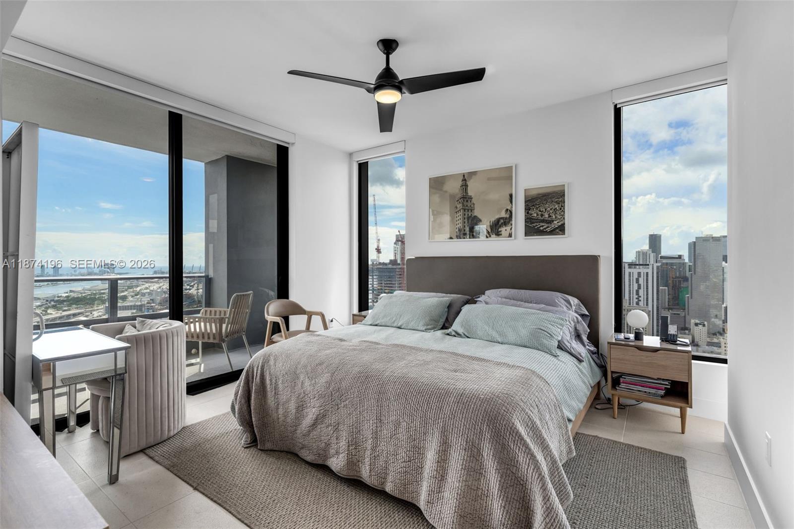 159 Northeast 6th Street, Unit 4016 Miami, FL 33132 - Photo 16 of 50 a bed room with a bed and a balcony