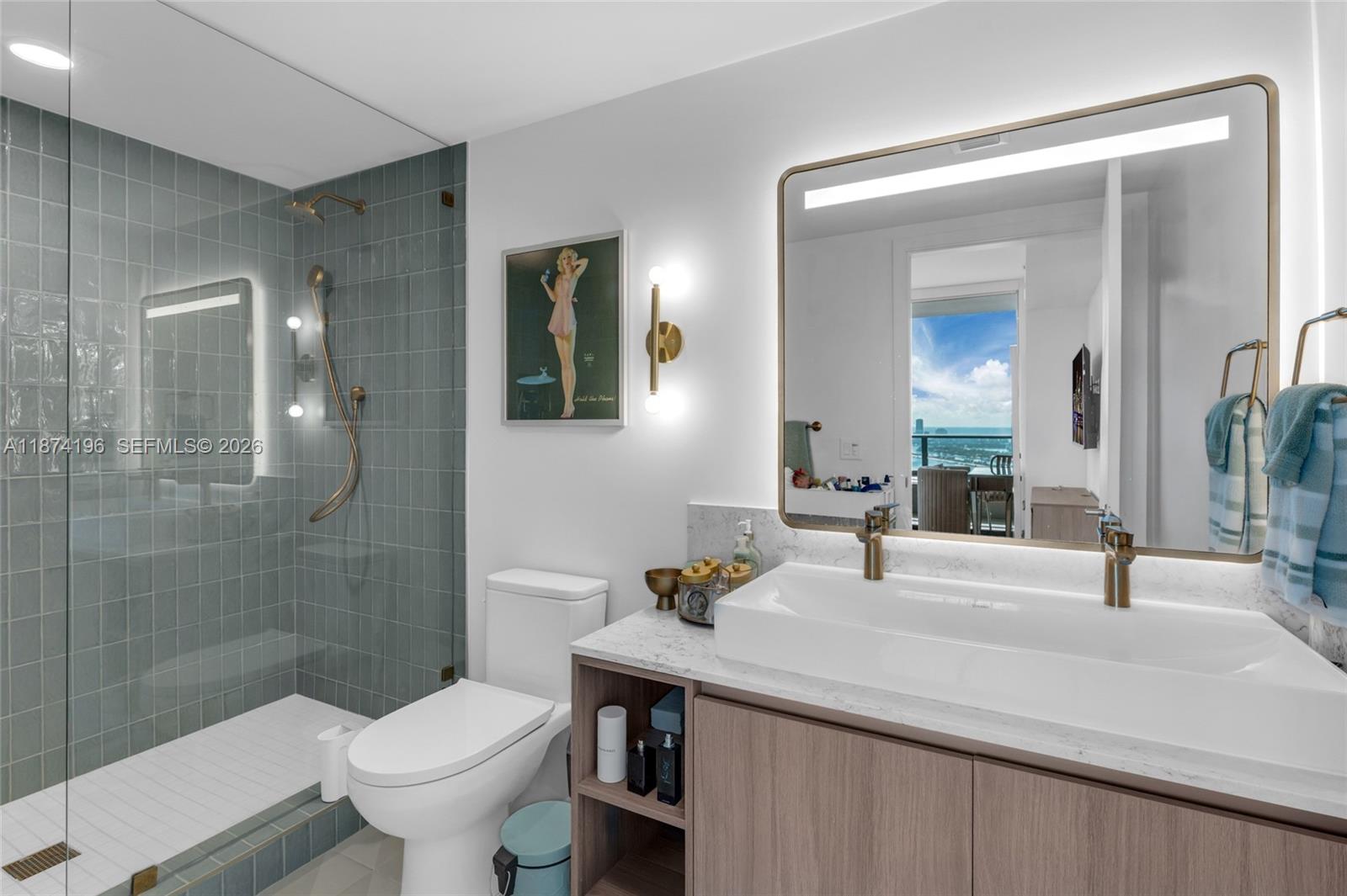 159 Northeast 6th Street, Unit 4016 Miami, FL 33132 - Photo 19 of 50 a bathroom with a sink toilet and shower