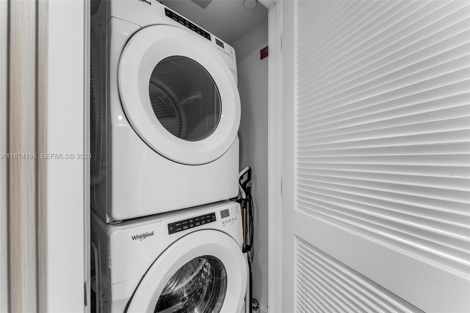 159 Northeast 6th Street, Unit 4016 Miami, FL 33132 - Photo 23 of 50 a utility room with dryer and washer