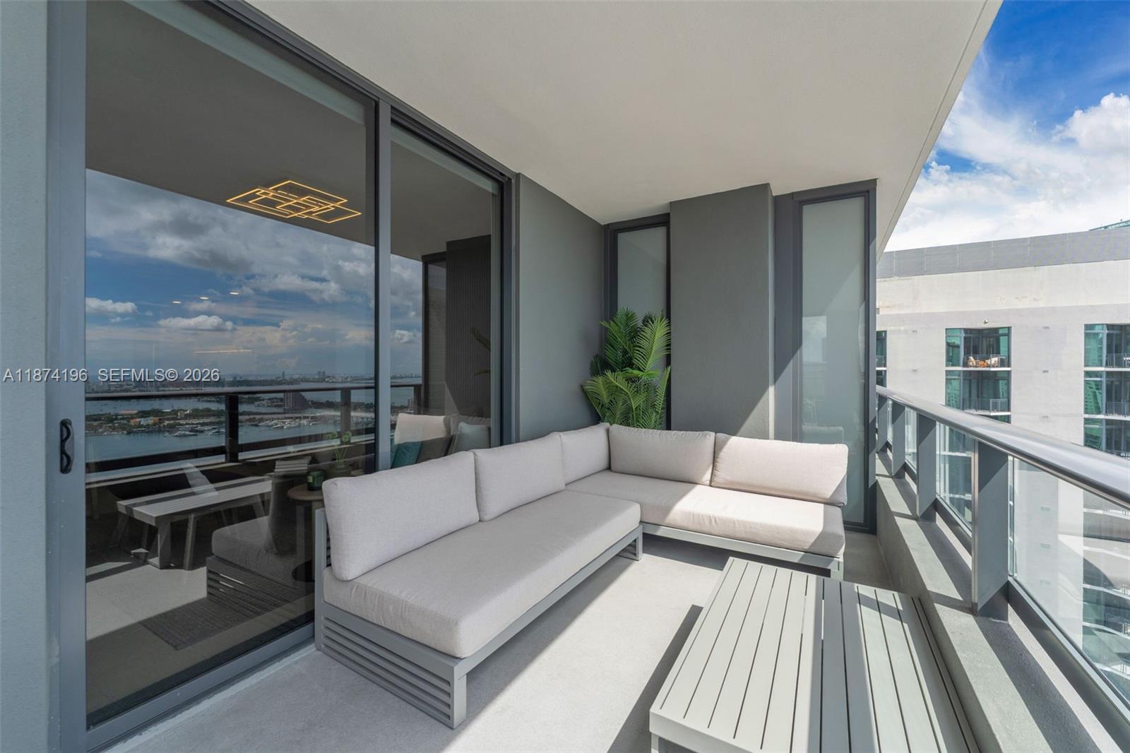 159 Northeast 6th Street, Unit 4016 Miami, FL 33132 - Photo 24 of 50 a living room with furniture and a floor to ceiling window
