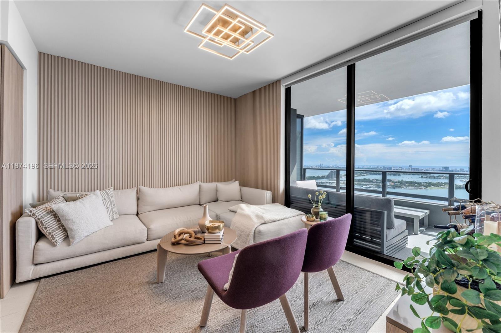 159 Northeast 6th Street, Unit 4016 Miami, FL 33132 - Photo 10 of 50 a living room with furniture and a large window