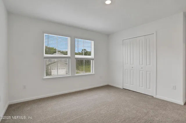 a kitchen with a sink and stainless steel appliances