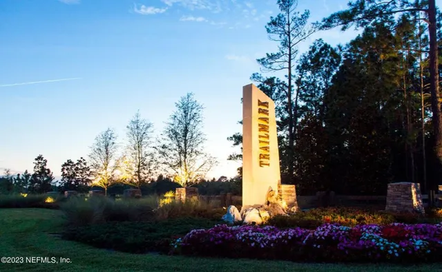 a view of a backyard with sitting area