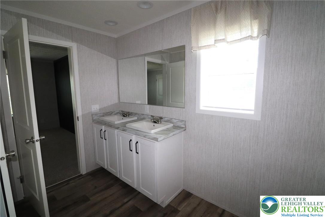 5020 Old Timber Road Stroudsburg, PA 18360 - Photo 16 of 32 a kitchen with a sink and a refrigerator