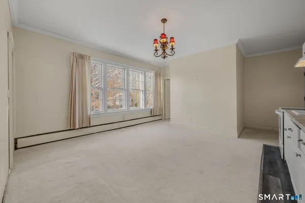 a view of an empty room with a window