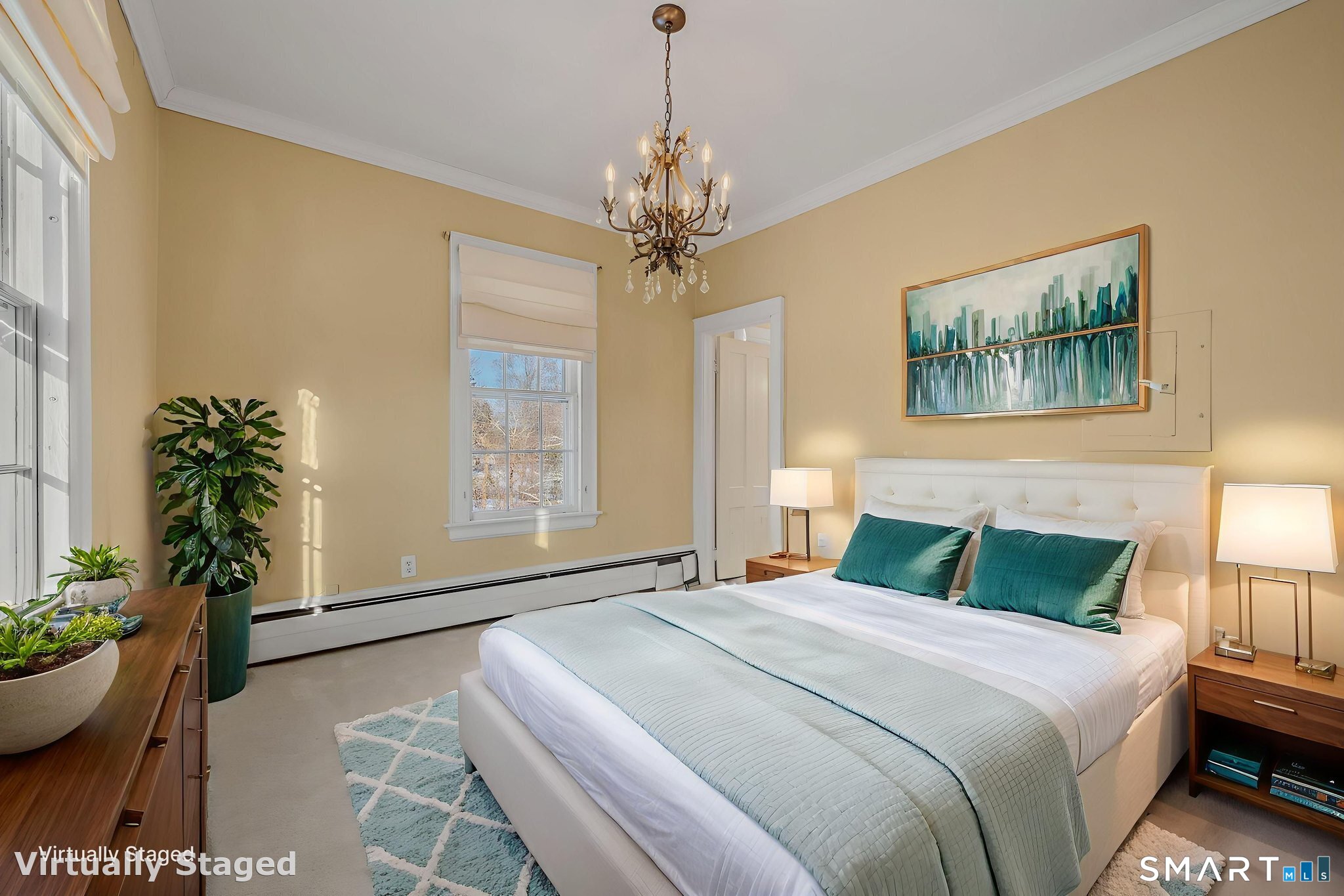 9 Lyme Street, Unit 7 Old Lyme, CT 06371 - Photo 15 of 23 a bedroom with furniture and a chandelier