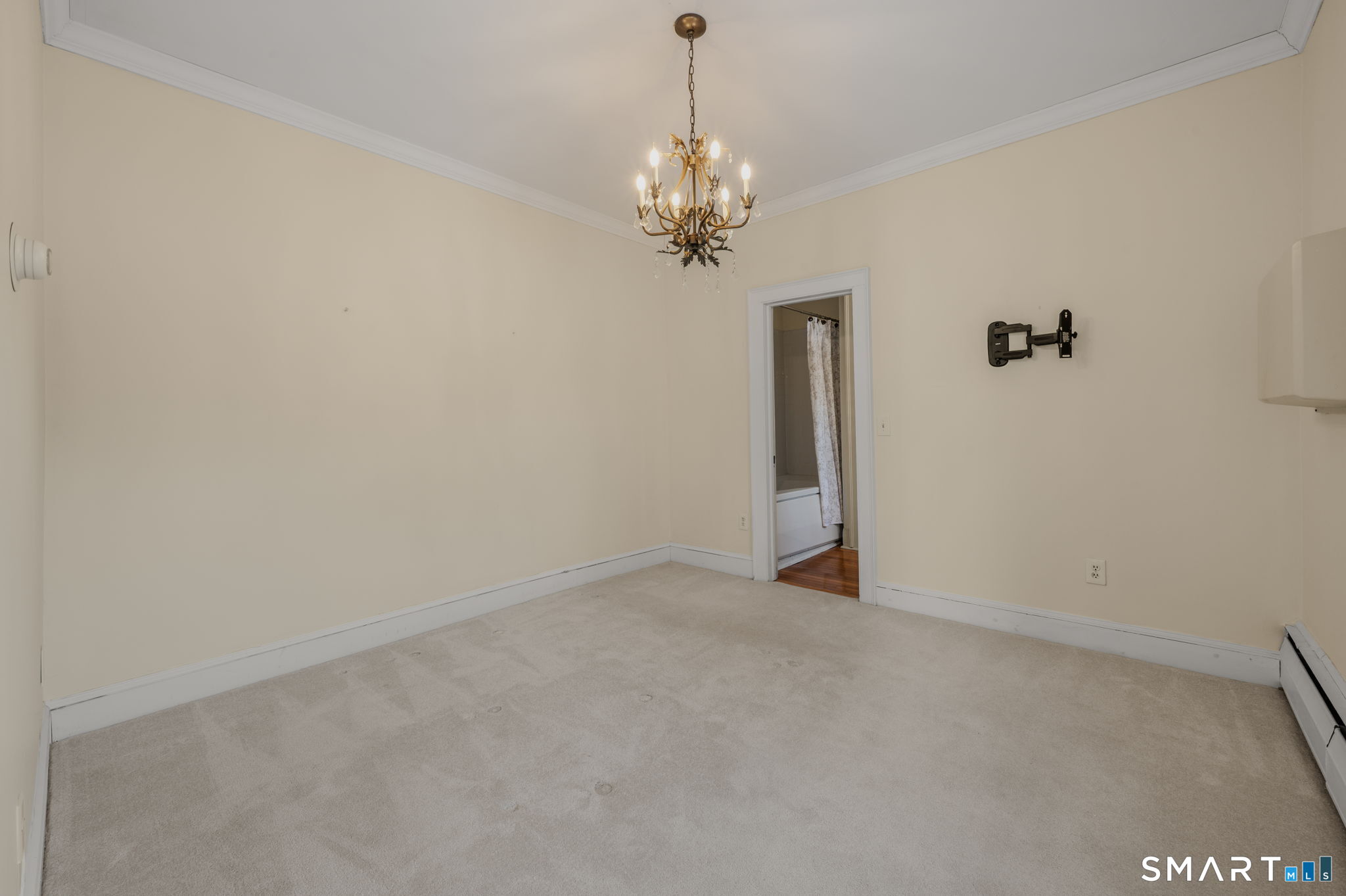 9 Lyme Street, Unit 7 Old Lyme, CT 06371 - Photo 20 of 23 a view of a chandelier in big room and chandelier