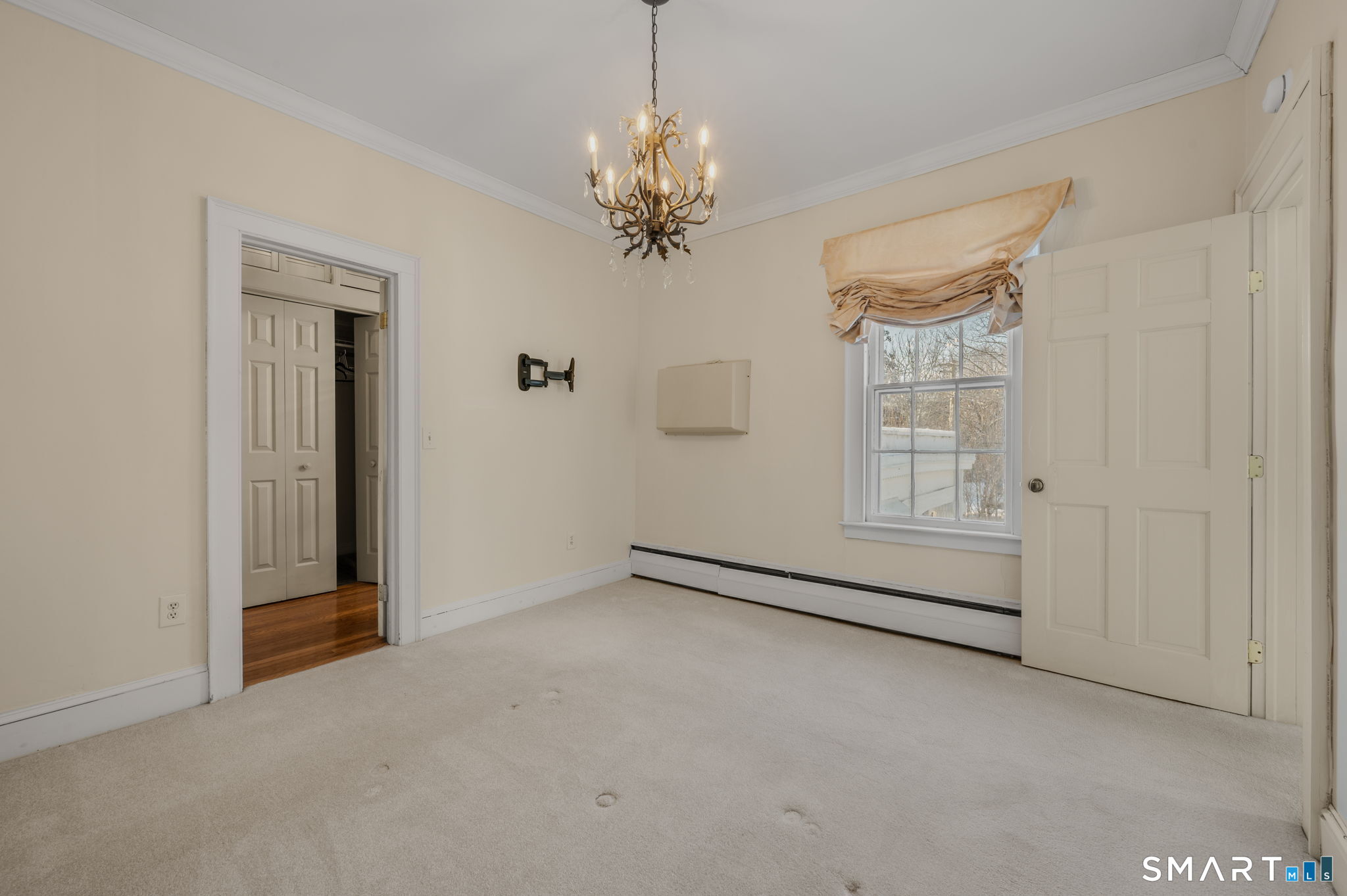 9 Lyme Street, Unit 7 Old Lyme, CT 06371 - Photo 22 of 23 wooden floor in an empty room with a window