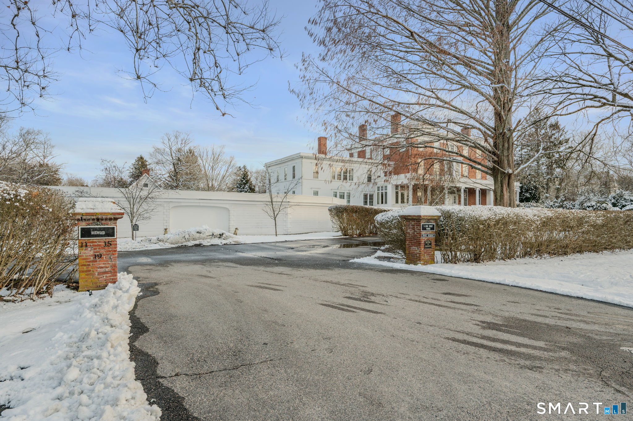 9 Lyme Street, Unit 7 Old Lyme, CT 06371 - Photo 6 of 23 a view of a dry yard with large trees