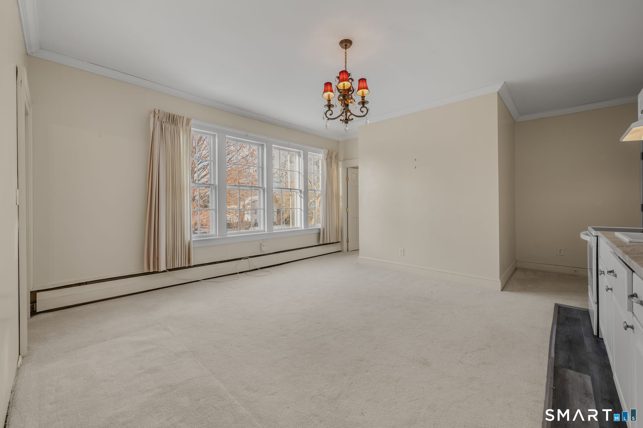 9 Lyme Street, Unit 7 Old Lyme, CT 06371 - Photo 9 of 23 a view of an empty room with a window