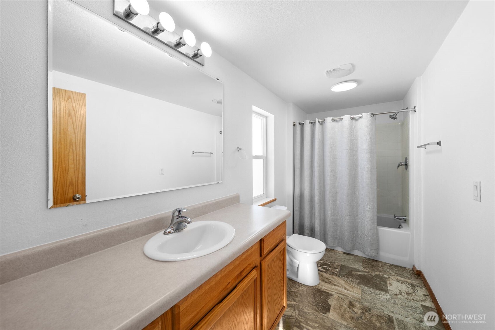 565 Boyd Loop Road Manson, WA 98831 - Photo 16 of 27 a bathroom with a sink and a mirror