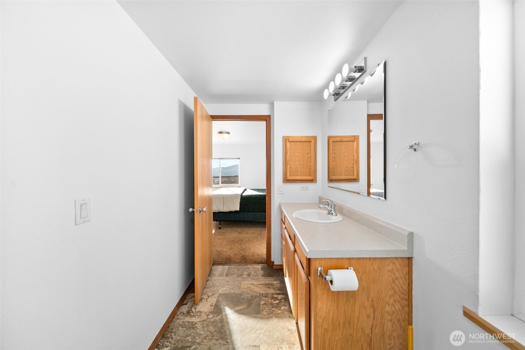 565 Boyd Loop Road Manson, WA 98831 - Photo 17 of 27 a en suite bathroom with a sink and a mirror