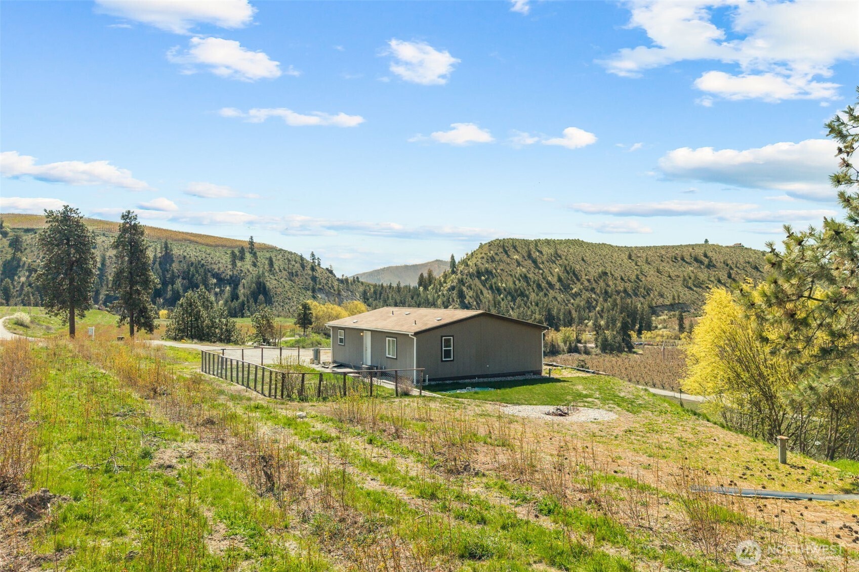 565 Boyd Loop Road Manson, WA 98831 - Photo 18 of 27 a view of a house with a yard