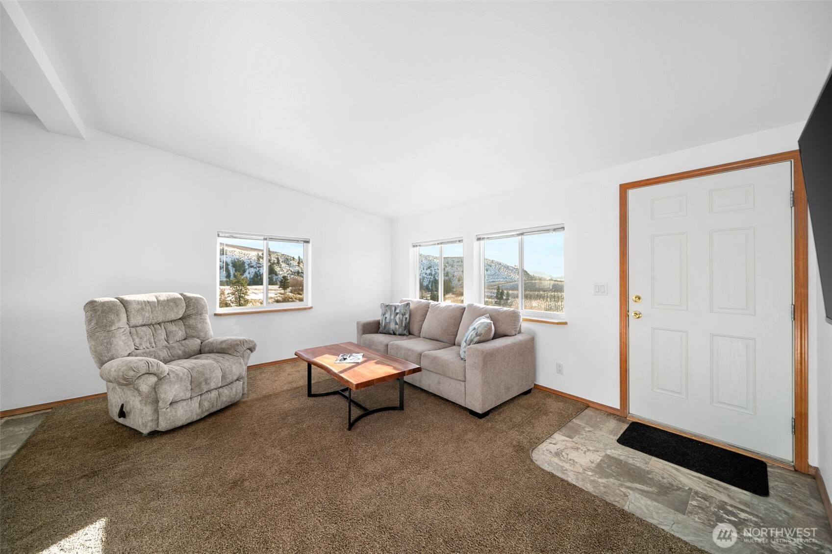 565 Boyd Loop Road Manson, WA 98831 - Photo 3 of 27 a living room with furniture and a window