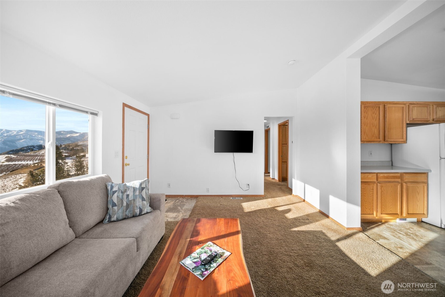 565 Boyd Loop Road Manson, WA 98831 - Photo 6 of 39 a living room with furniture and a flat screen tv