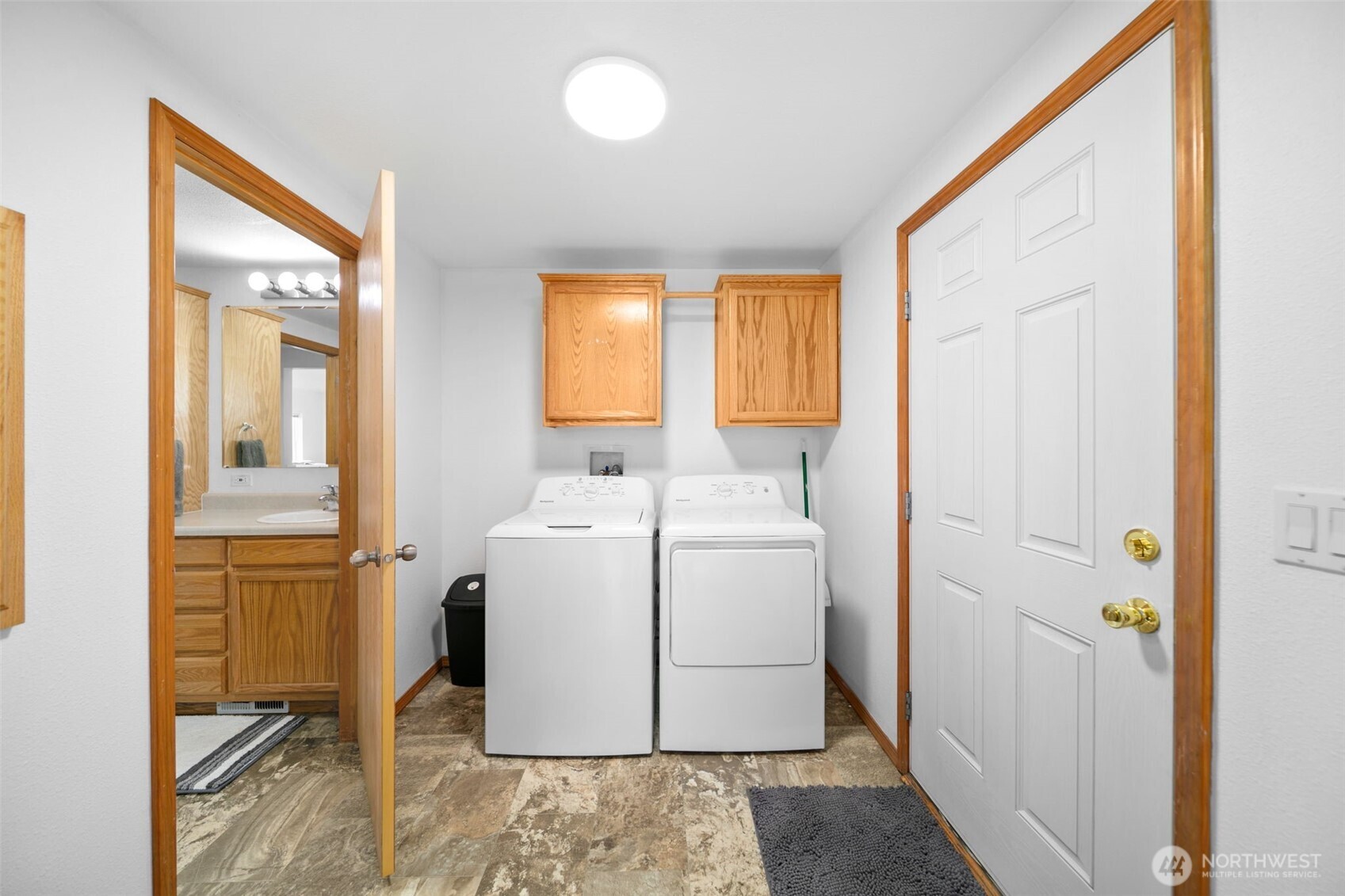 565 Boyd Loop Road Manson, WA 98831 - Photo 9 of 27 a utility room with dryer and washer