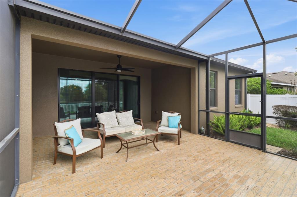 34144 Spring Oak Trail Wesley Chapel, FL 33545 - Photo 20 of 37 a view of a patio with a table and chairs