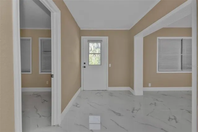 a kitchen with stainless steel appliances a refrigerator sink and cabinets