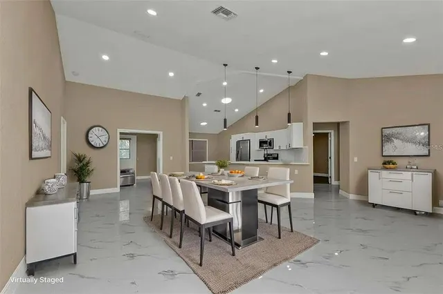 a view of a dining room with furniture