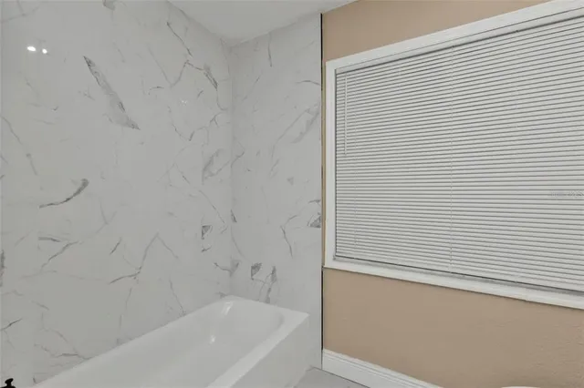 a bathroom with a bathtub