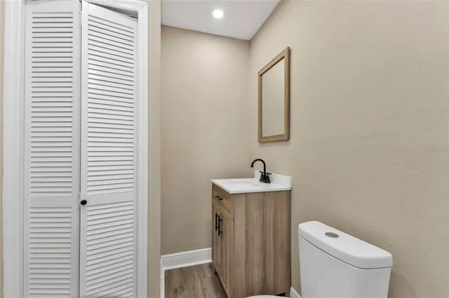 a bathroom with a shower toilet and sink