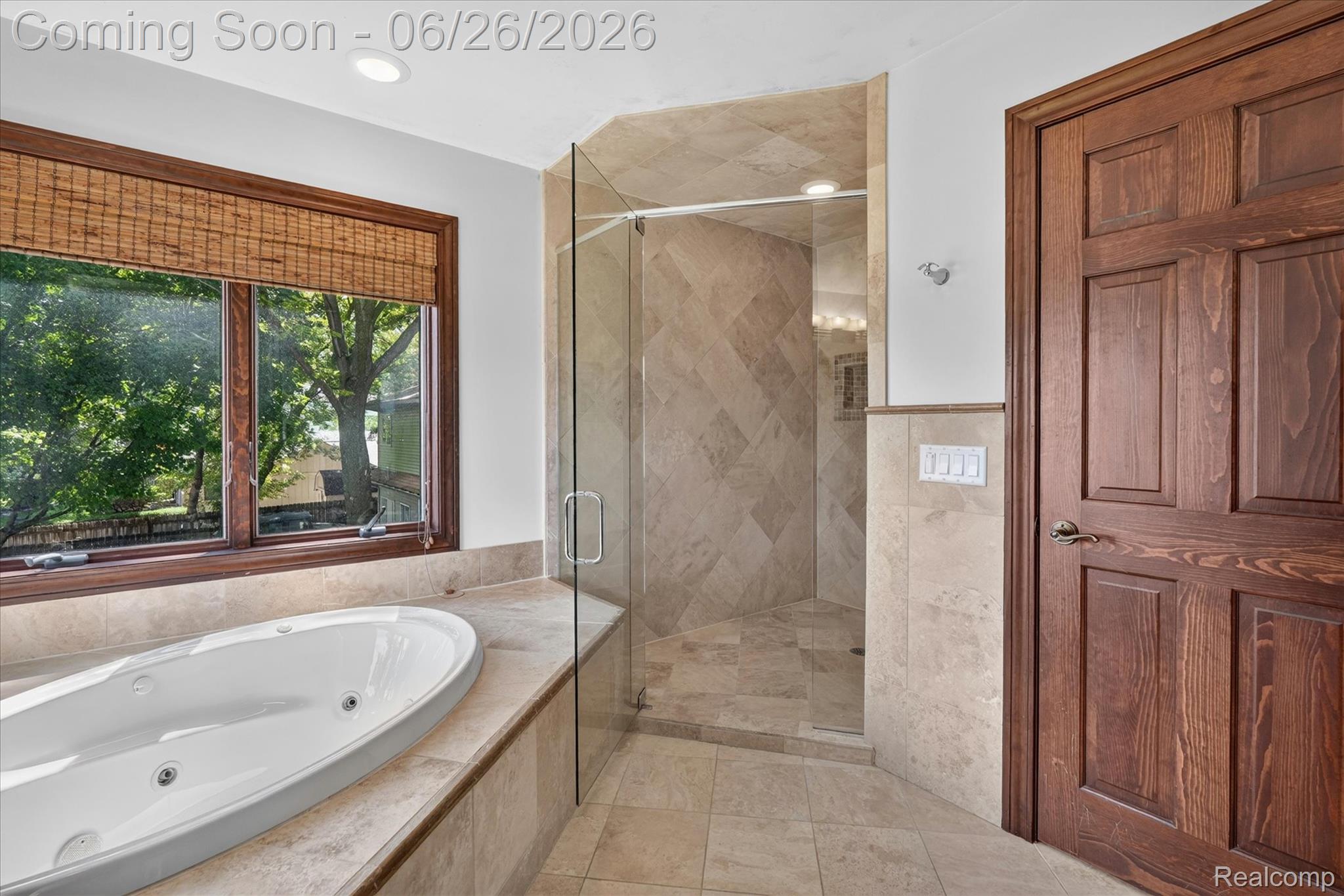 3478 Lexington Road Waterford, MI 48328 - Photo 17 of 52 Bathroom featuring a jetted soaking tub, a separate glass-enclosed shower with tiled surround, and wood-framed windows with woven blinds