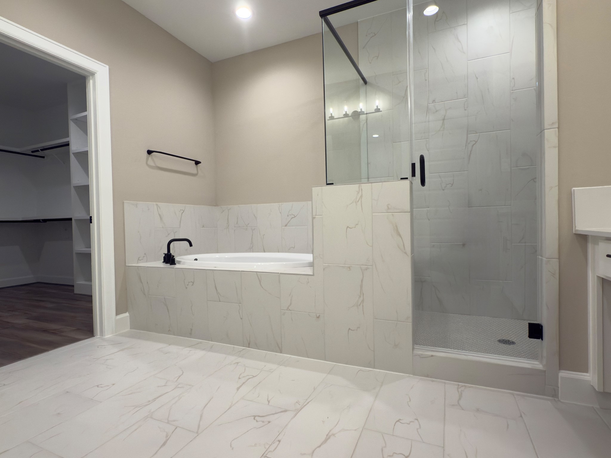 4309 B Dickson Street Houston, TX 77007 - Photo 9 of 11 Enjoy the ultimate in convenience and style with the ROCburne primary bath’s dual vanities, offering personal space and a spa-like experience. Image depicts home as-is.