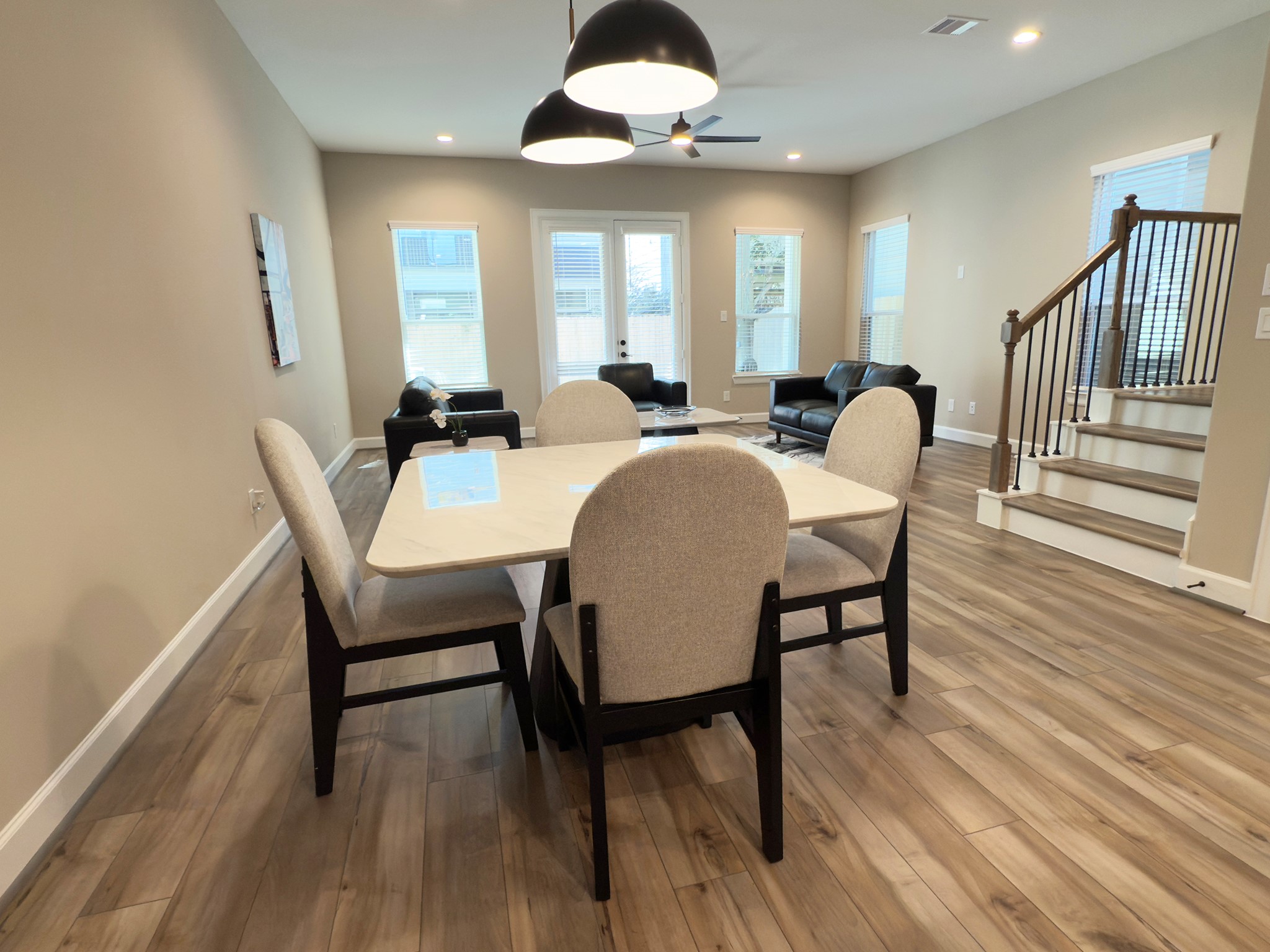 4309 B Dickson Street Houston, TX 77007 - Photo 12 of 12 The ROCburne’s dining area blends seamlessly with the open floor plan, offering a bright, inviting space perfect for both intimate dinners and lively gatherings. Image depicts home as-is.