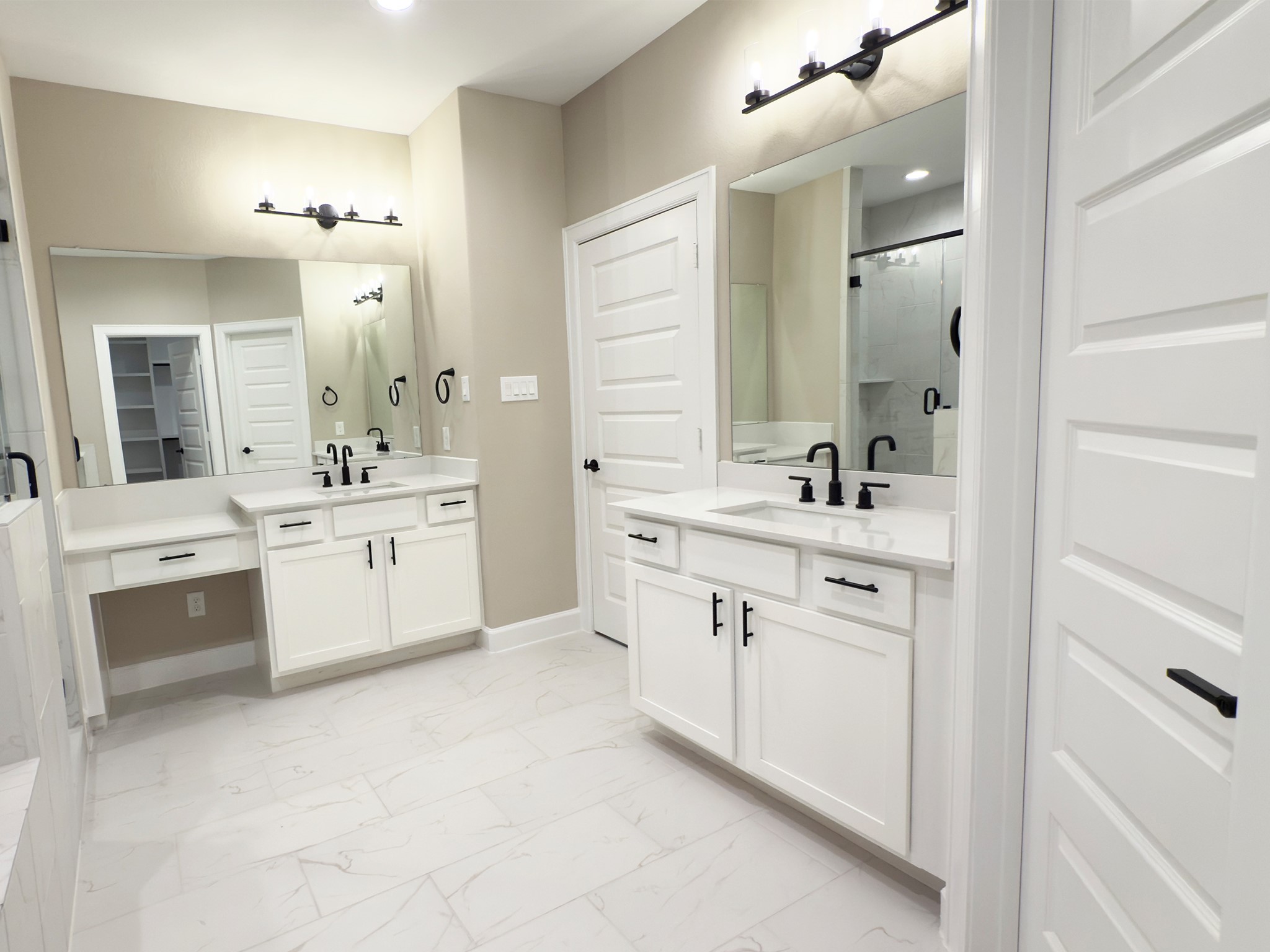 4309 B Dickson Street Houston, TX 77007 - Photo 4 of 12 The ROCburne primary bath offers a spa-like retreat with a deep soaking tub and a sleek, glass-enclosed shower, blending relaxation and modern style. Image depicts home as-is.