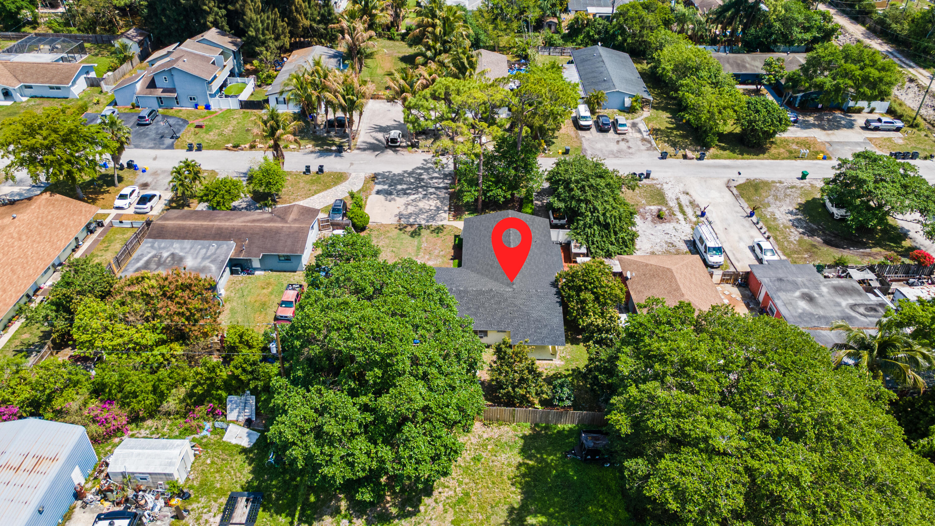 4453 Stevens Road Lake Worth Beach, FL 33461 - Photo 8 of 67 an aerial view of a house with a garden and swimming pool