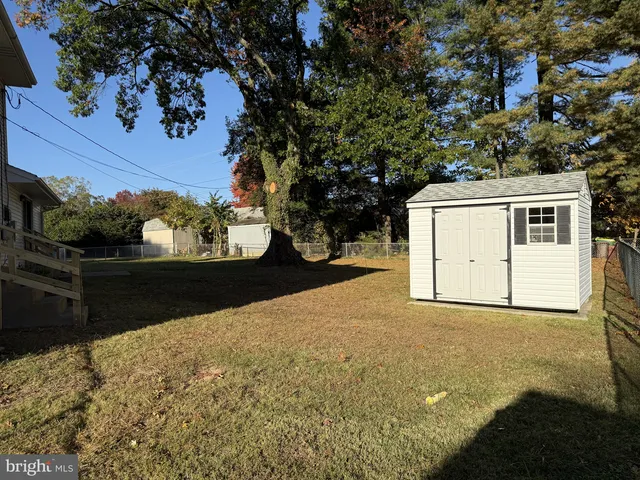 a view of a backyard of the house